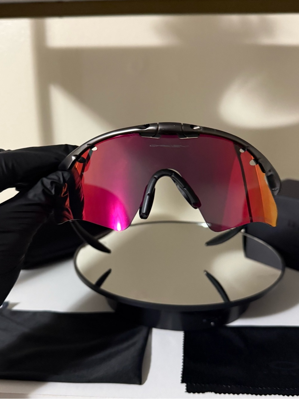 Oakley Black Frame Sunglasses with Pink-Red Mirrored Lens
